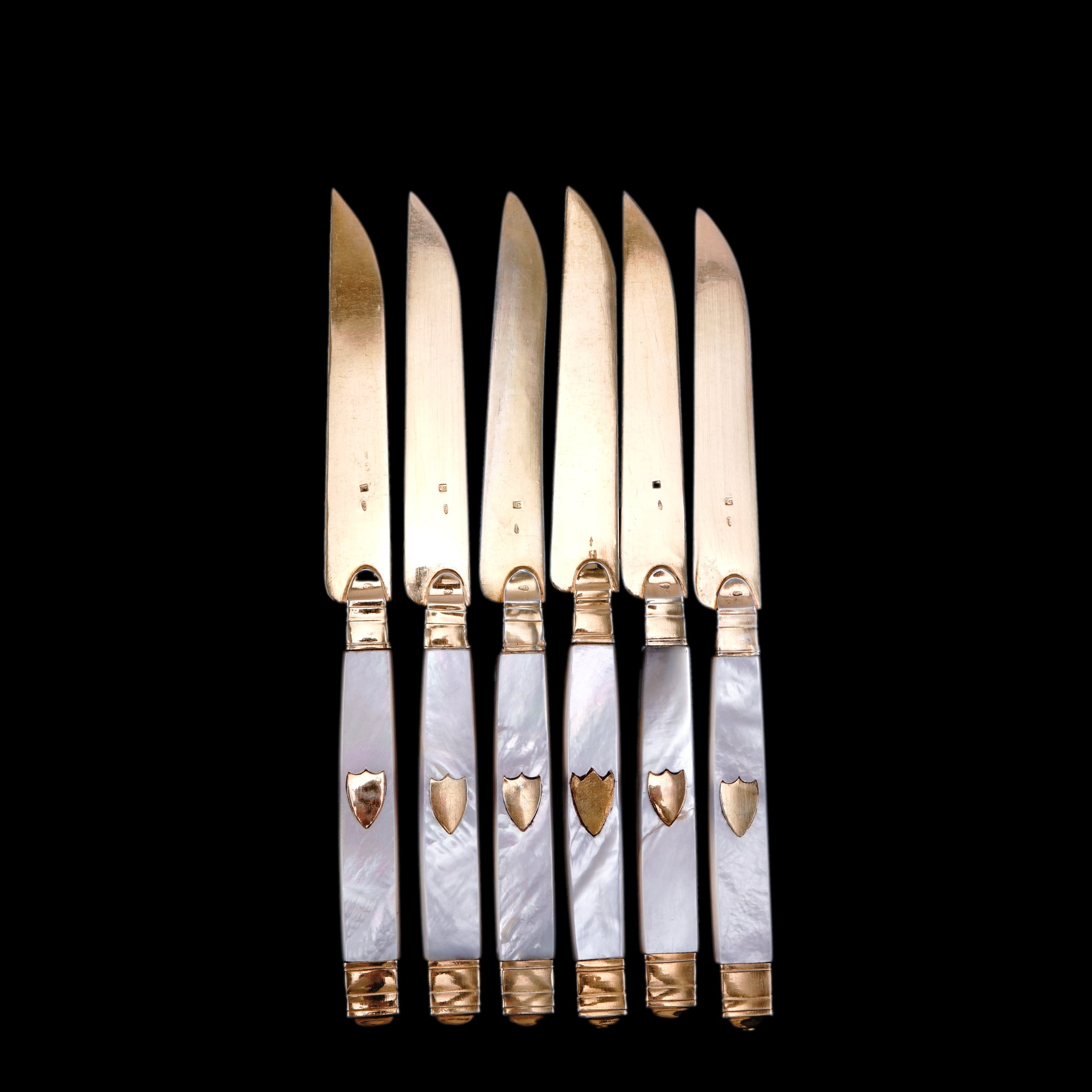 Twenty Victorian silver and mother of pearl folding fruit knives Twenty Victorian silver and mother of pearl folding fruit knives