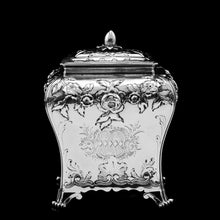 Load image into Gallery viewer, Antique Georgian Solid Sterling Silver Tea Caddy with Floral Embossed Design and Coat of Arms - Daniel Smith &amp; Robert Sharp 1765
